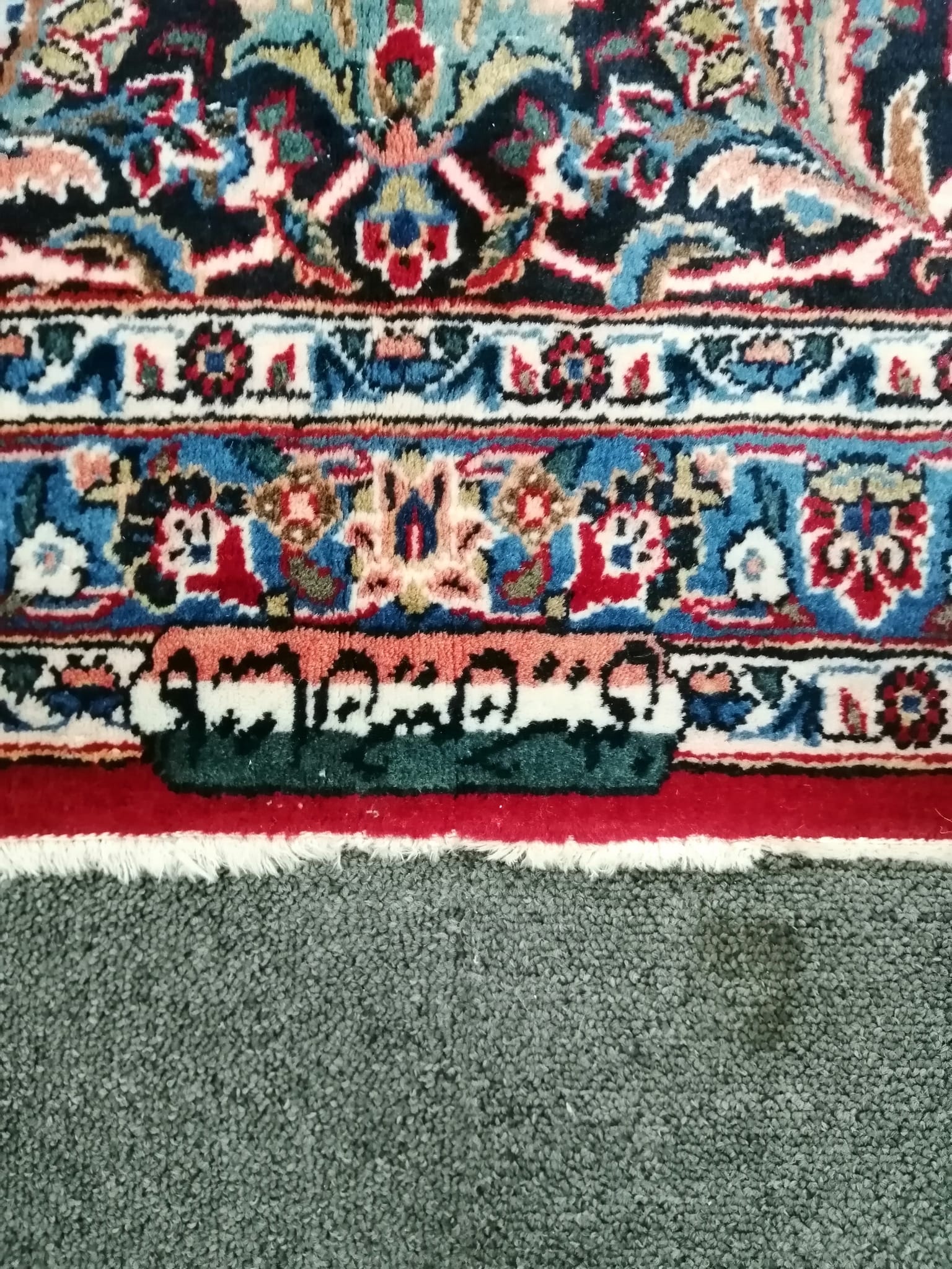 A Tabriz burgundy ground carpet, 460 x 330cm